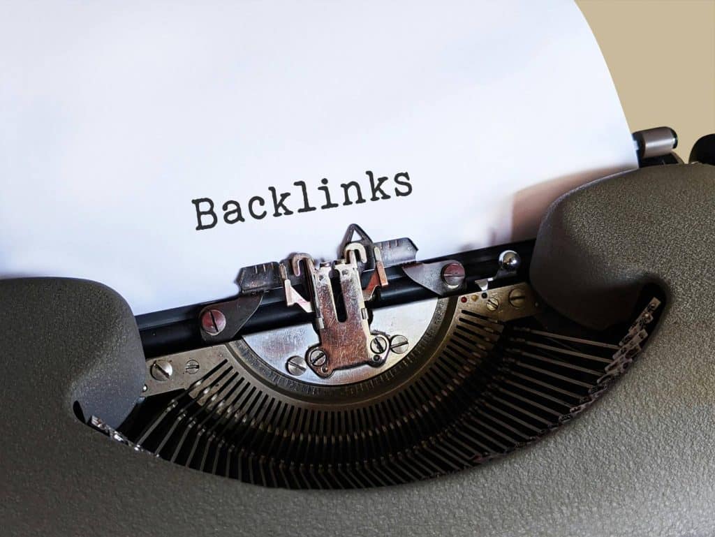 Close up image of the word "backlinks" printed on a piece of paper;